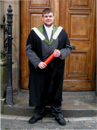 Robert with degree scroll